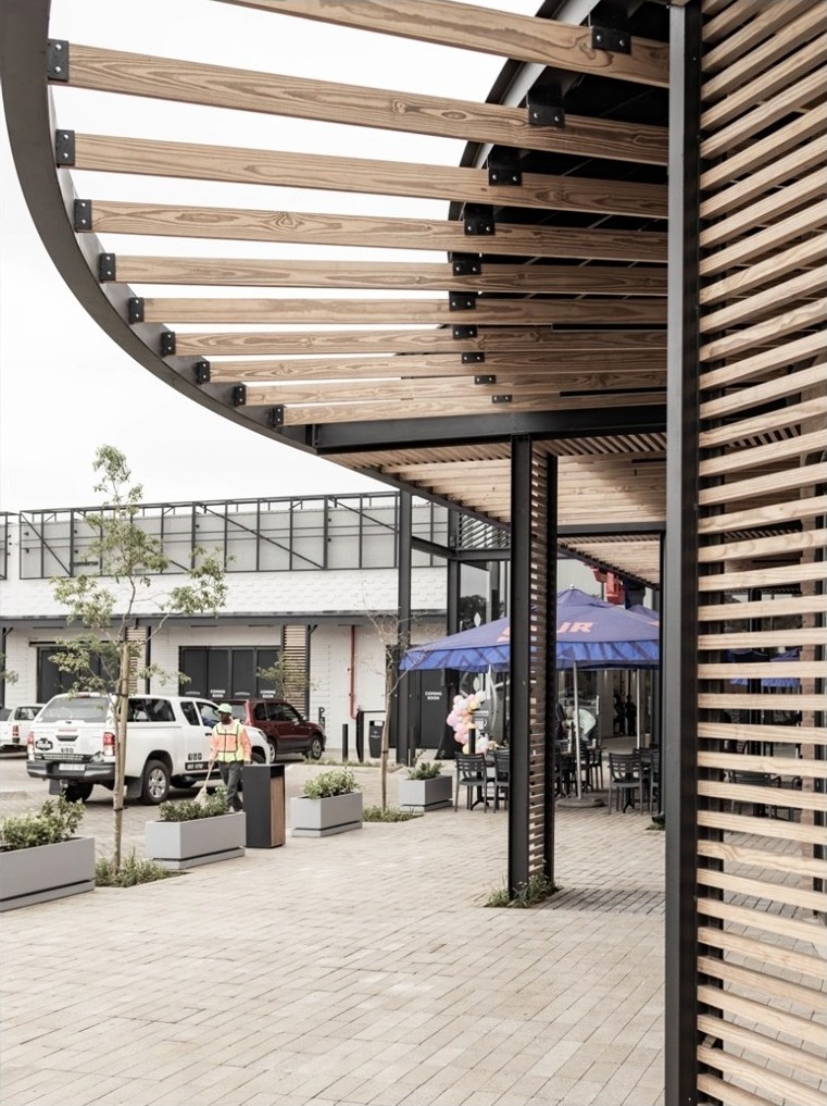 Timber canopy and planted retail passage at Moreleta Corner